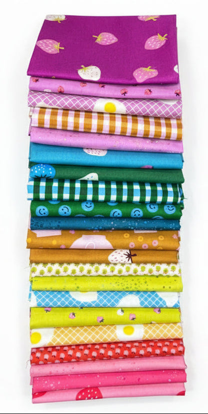 Stack of colorful fabric strips with various patterns on a white background