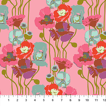 Colorful floral fabric pattern on a pink background with a ruler at the bottom.