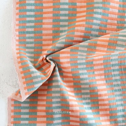 Fableism Lucky Loom Interlock in Watermelon - reversible woven cotton fabric in pink, orange, and mint stripes