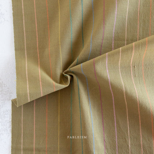 Lucky Loom Skinny Stripe in Clover – reversible cotton fabric with mossy green background and multicolor skinny vertical stripes in blue, orange, and lilac tones