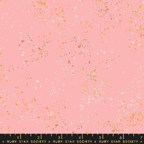 A quilted cotton fabric with a speckled pattern in various shades of pink, designed by Rashida Coleman Hale for Ruby Star Society.