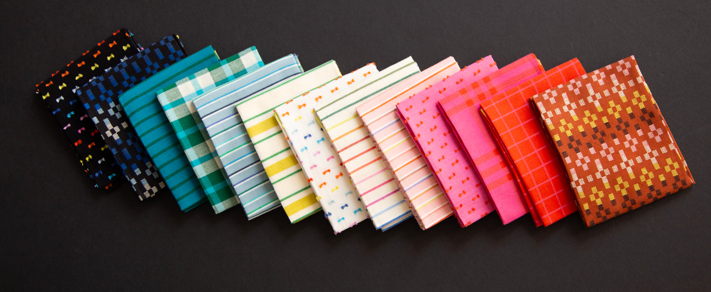 Row of colorful fabric swatches on a dark background ruby star mystic fable collection