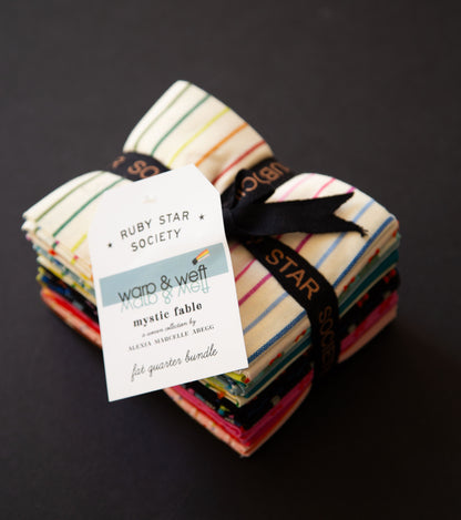 Stack of fabric bundles with a label on a dark background